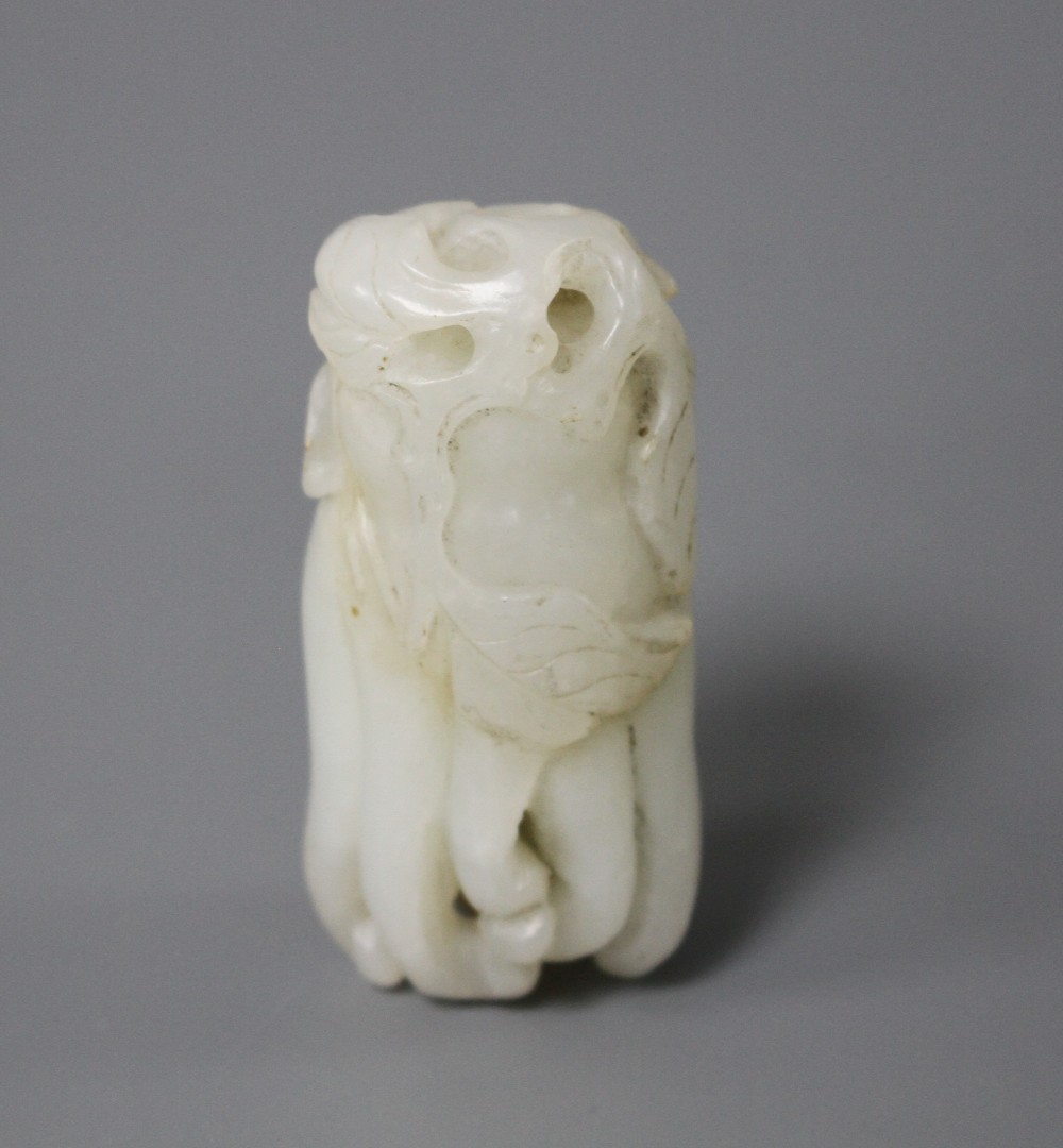 A Chinese jade carving of a finger citron, length 5.5cm, width 2.5cm, depth 2cm